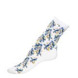 Chaussette femme mi-haute blanche motif oiseaux bleus et jaunes, vue latérale.