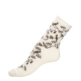 Chaussette femme mi-haute blanche à motifs oiseaux gris et branches noires avec packaging Maison Broussaud.